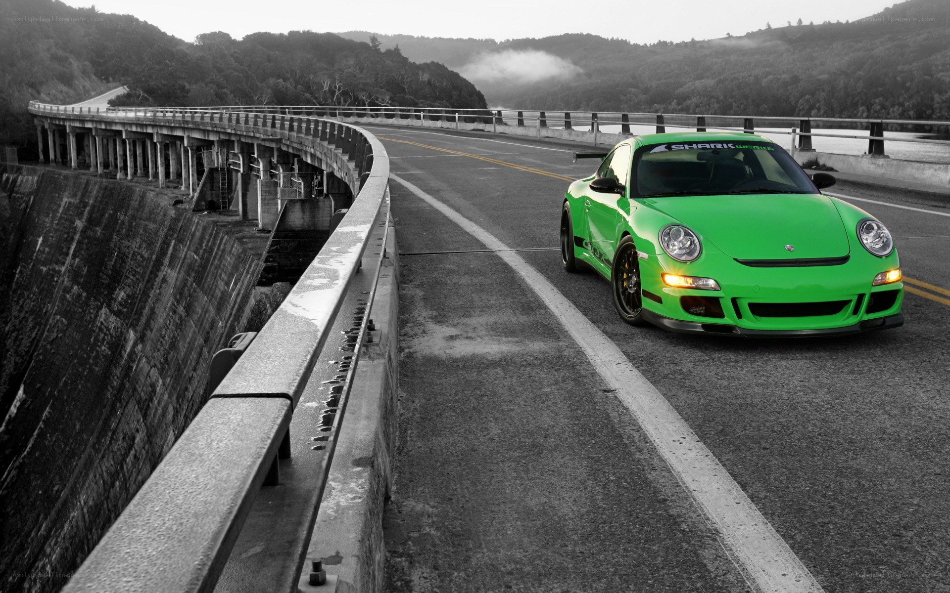 Green Porsche on a bridge