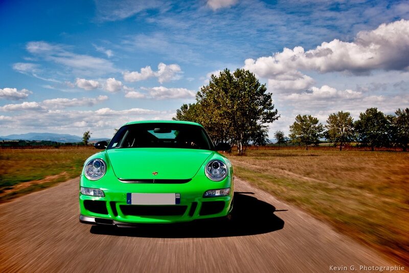 Green Porsche on a country road