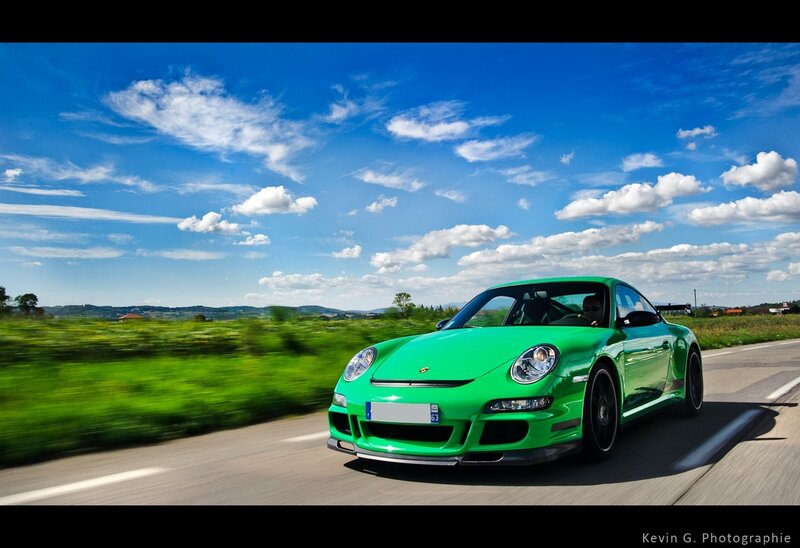 Green Porsche on a country road
