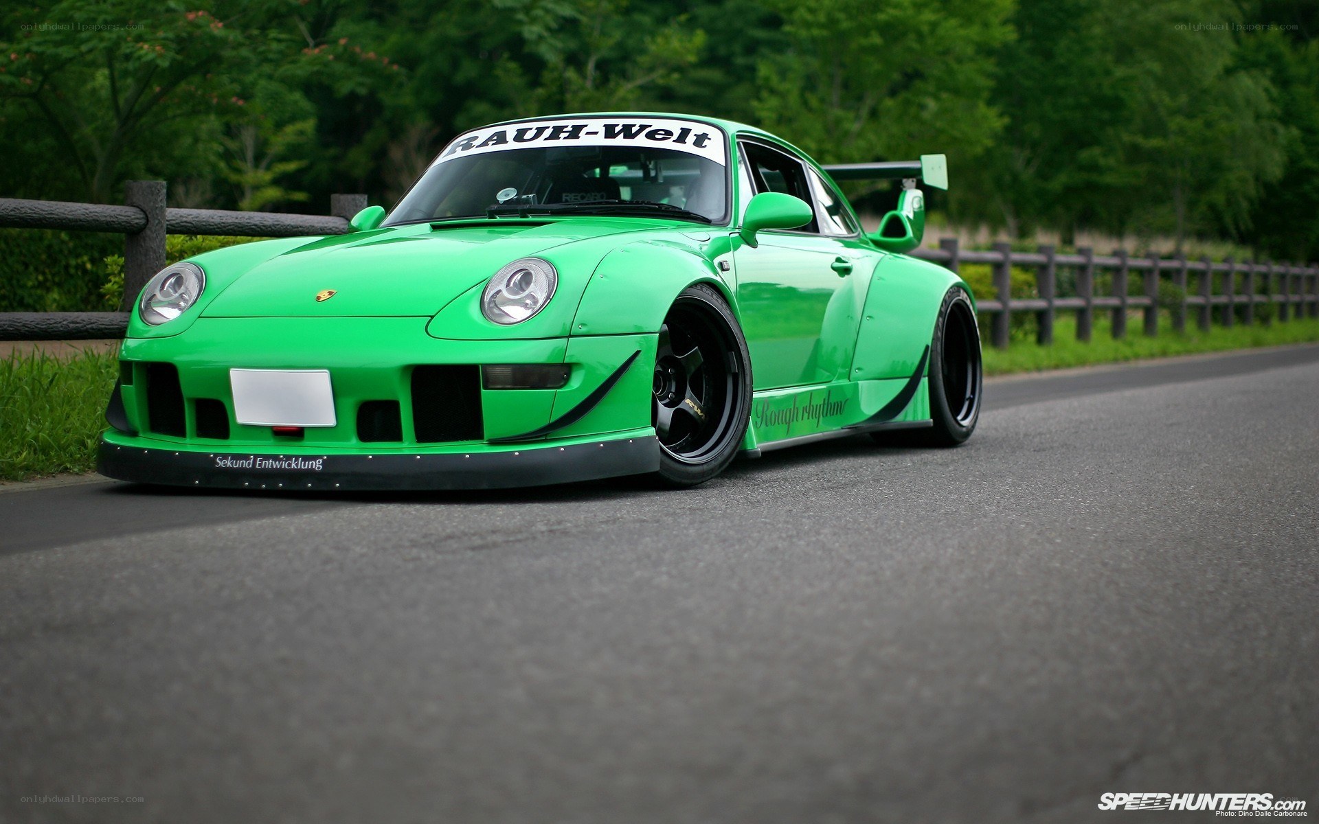 green porsche on a road