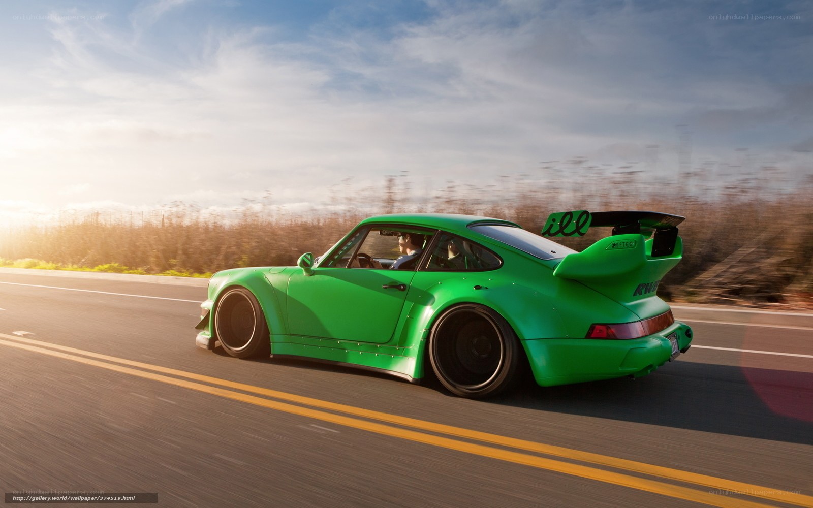 Green Porsche on a road