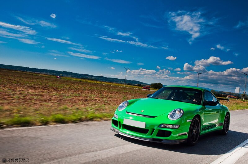 Green Porsche on country road