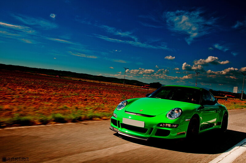 green porsche on country road