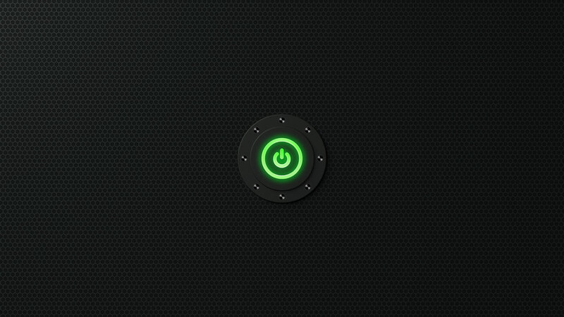 green power button on black background