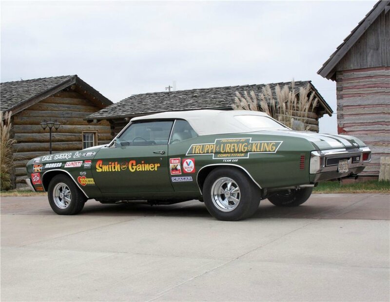 Green Race Car — Calm, Afternoon, Photograph, Log Cabins