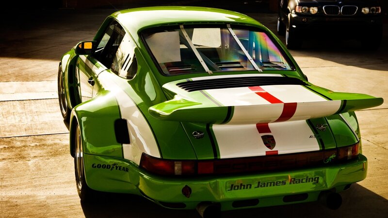 Green Race Car — Dramatic, Photograph, Garage