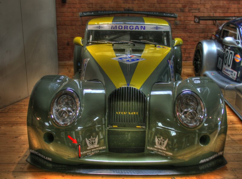 Green Race Car — Dramatic, Photograph, Race Car, Brick Wall