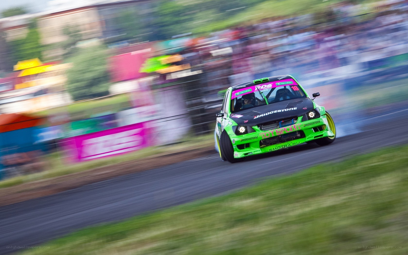 Green race car drifting