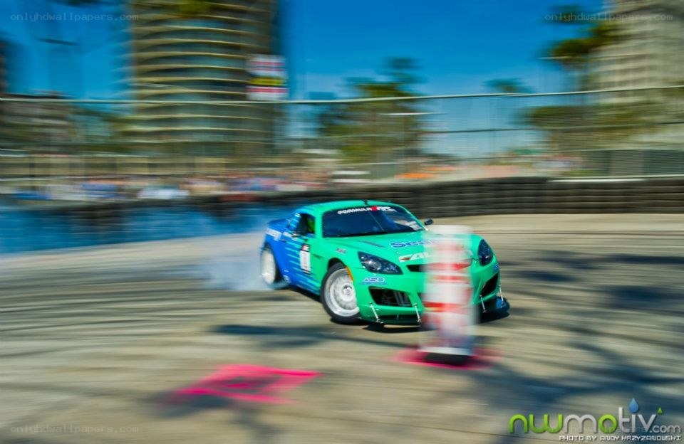 Green race car drifting