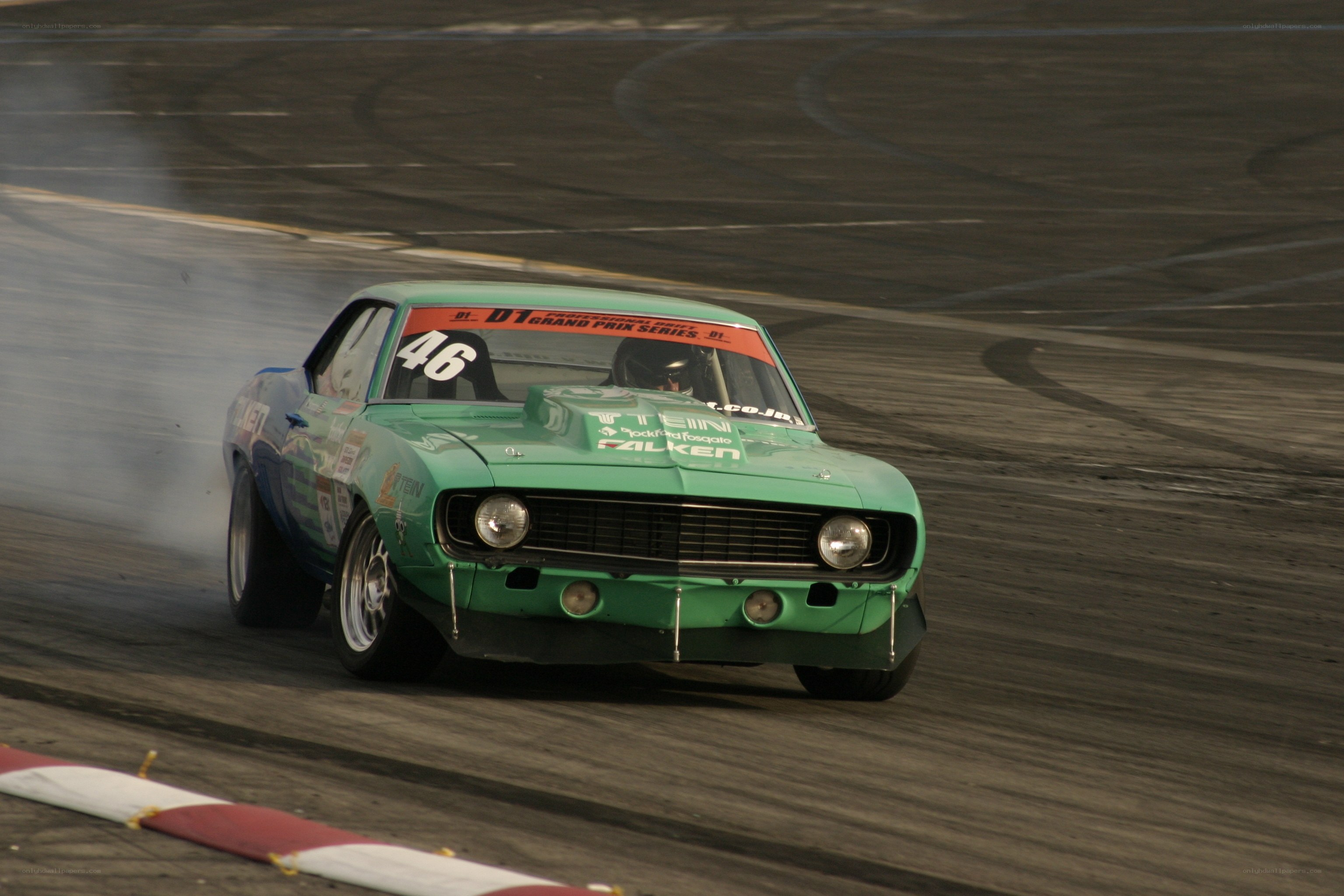 Green race car drifting