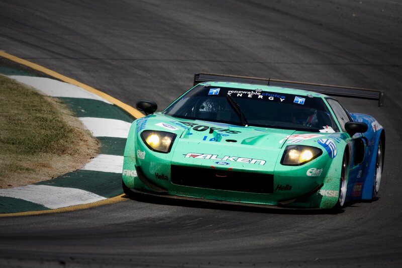 Green Race Car — Dynamic, Afternoon, Photograph, Race Track, Grass, Curb
