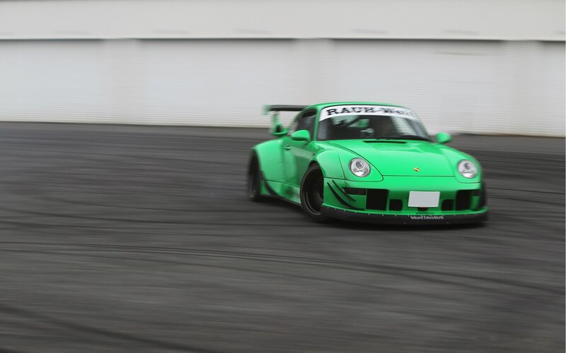 Green Race Car — Dynamic, Photograph, Race Track, Tire Marks, Windshield Banner, Black
