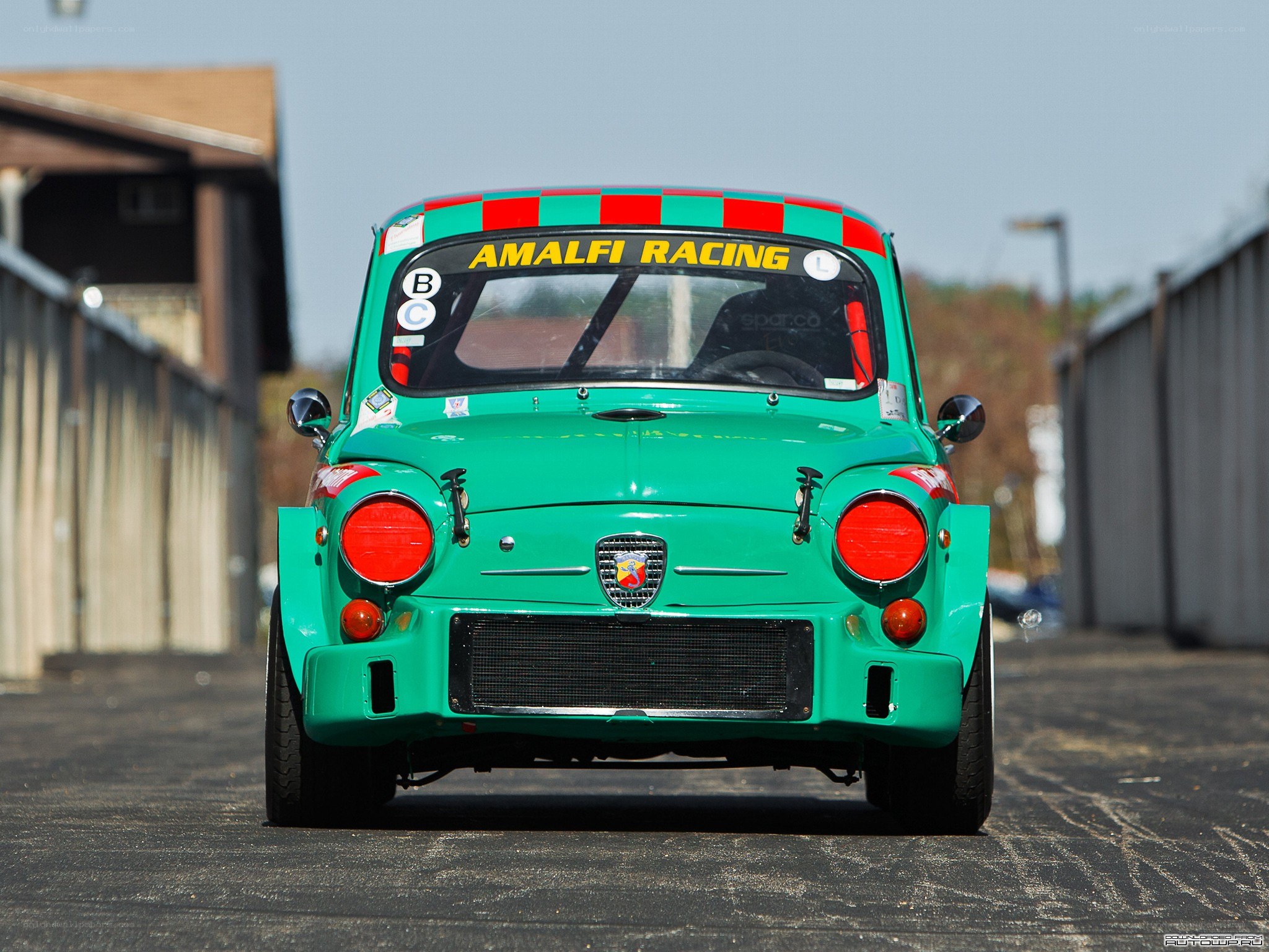 Green race car from rear view