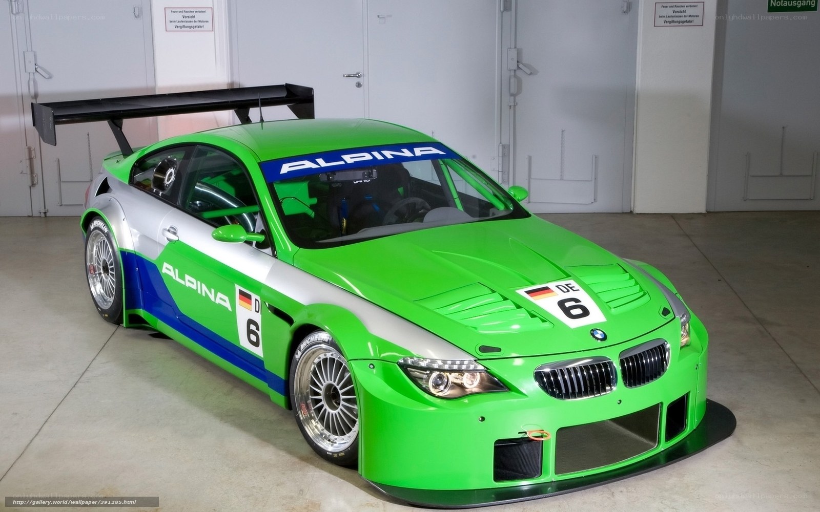 green race car in garage