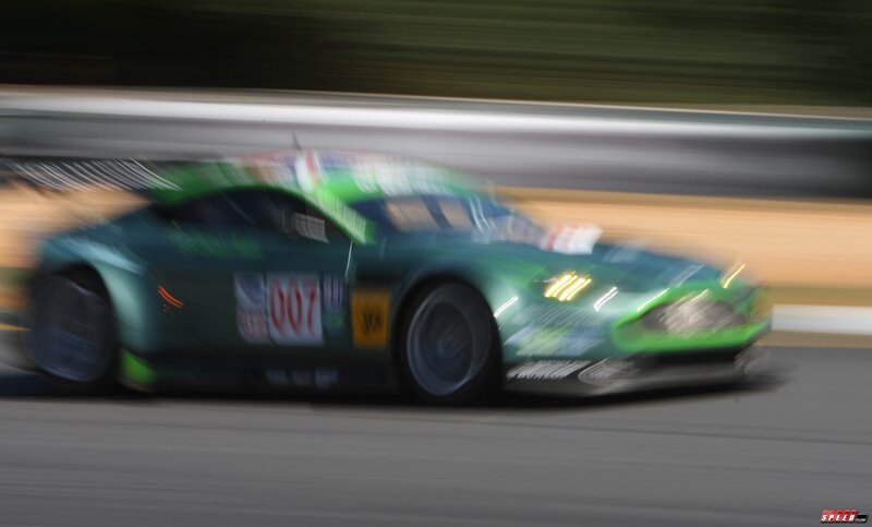 green race car in motion