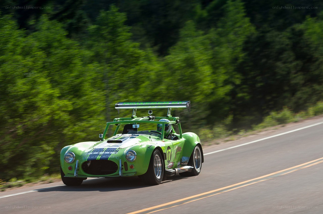 green race car on road