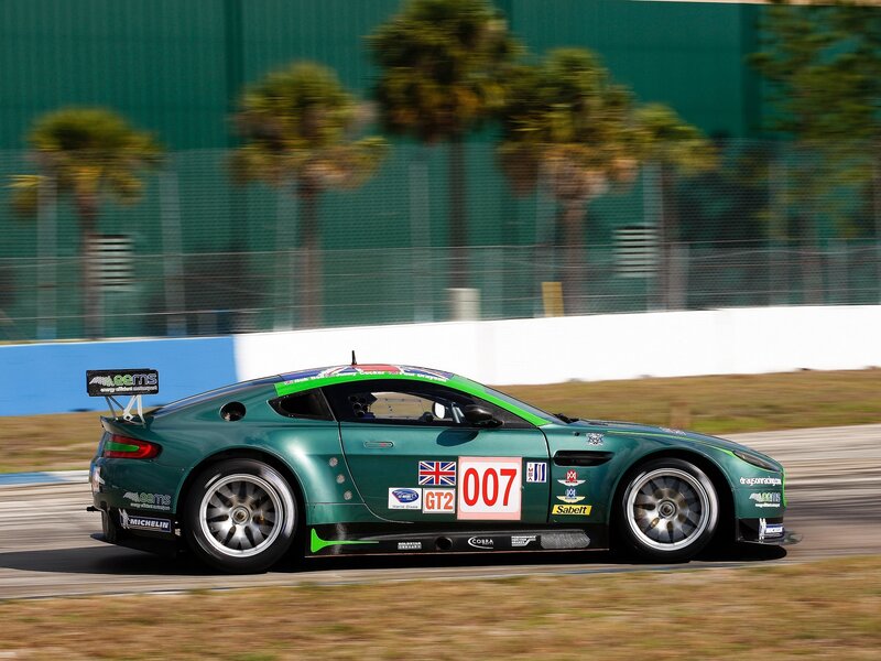 Green race car on track