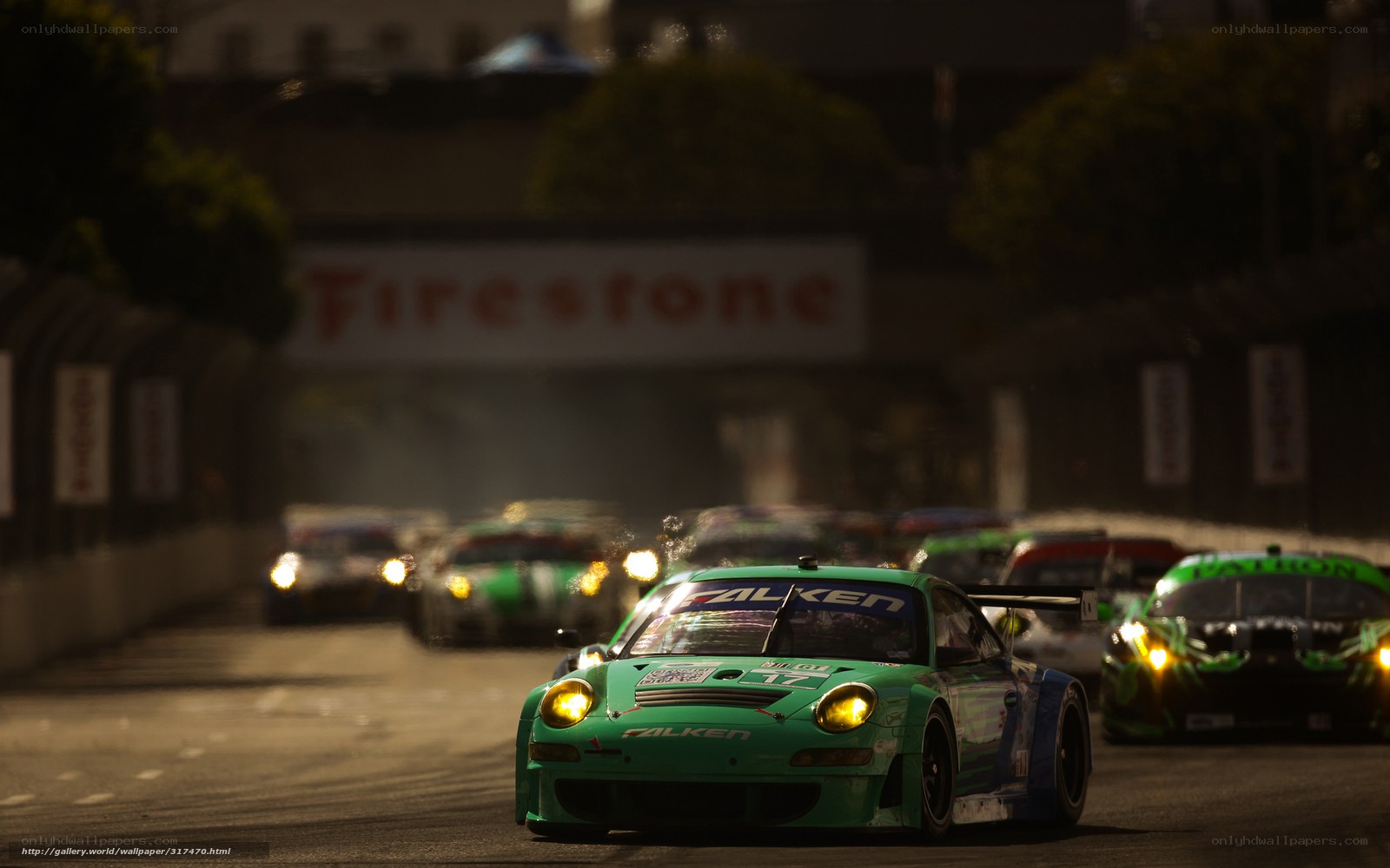 Green race car on track