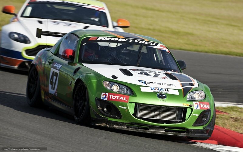 Green race car on track