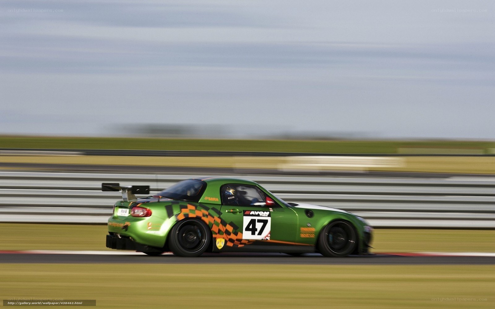 green race car on track