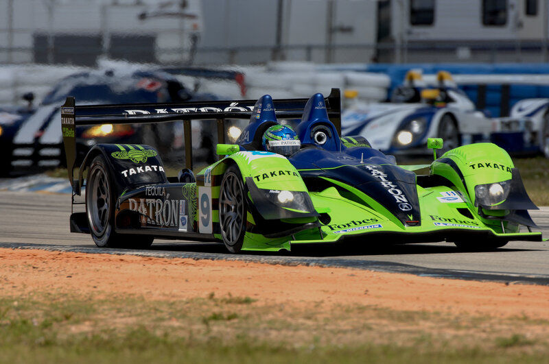 Green race car on track