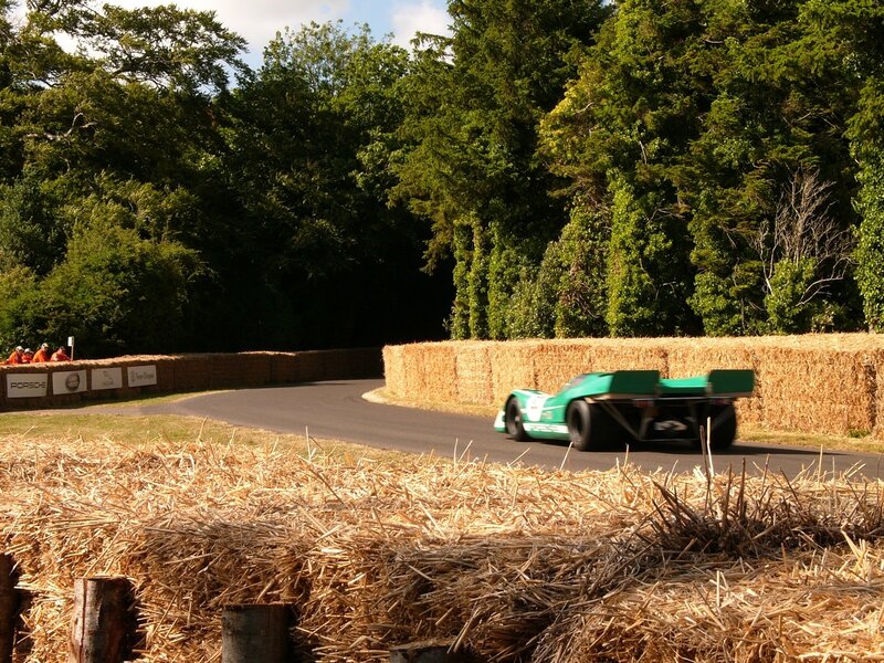 Green race car on track