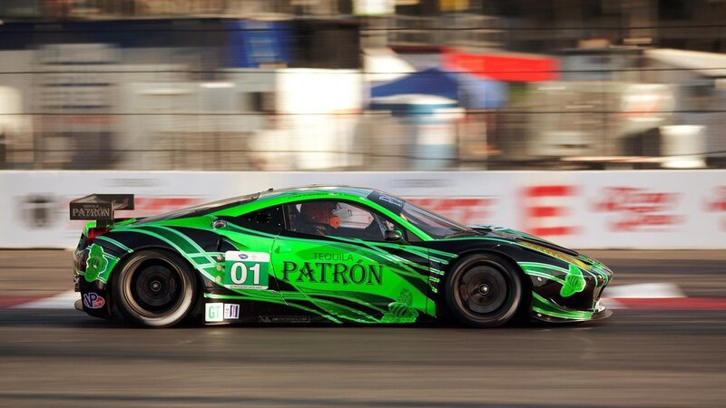 Green race car on track