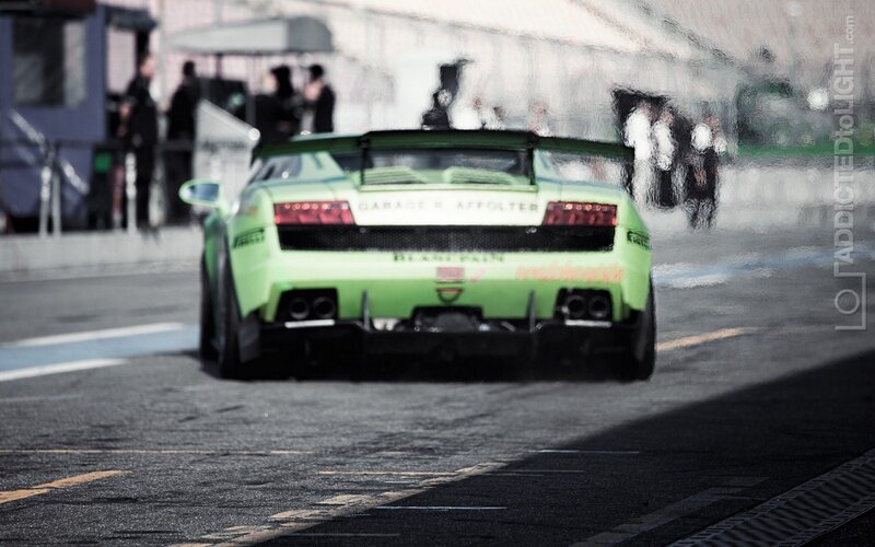 green race car on track