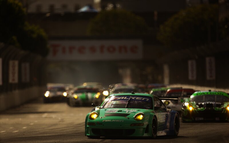 Green race car on track