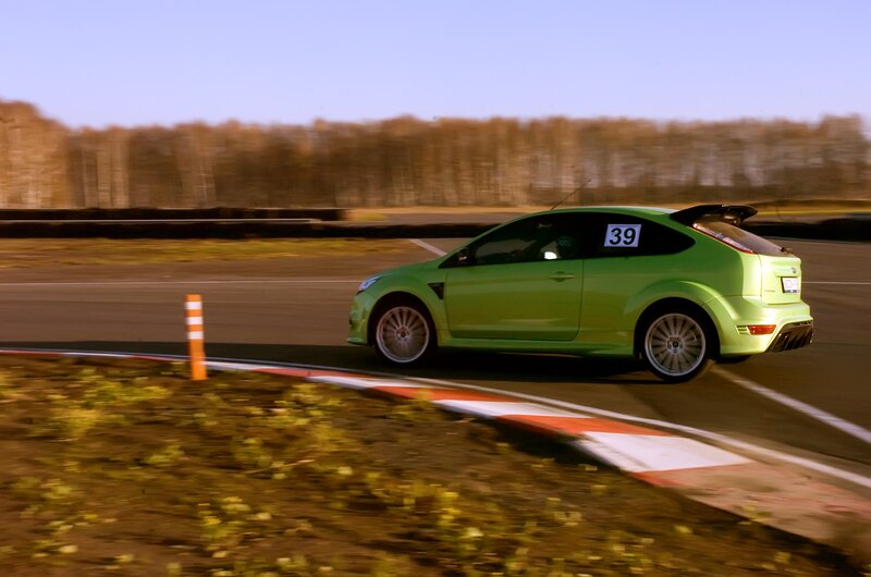 Green race car on track