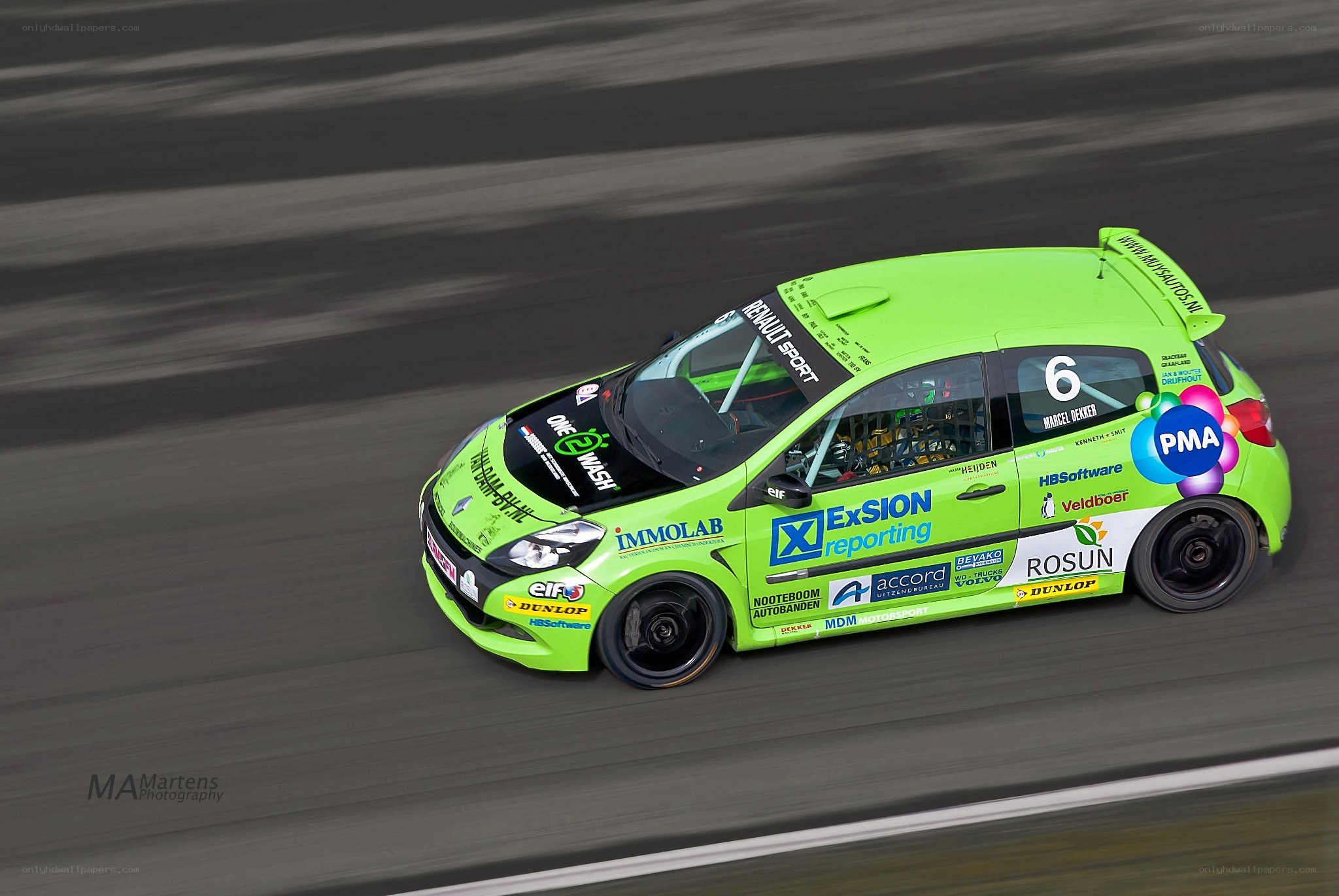 Green race car on track