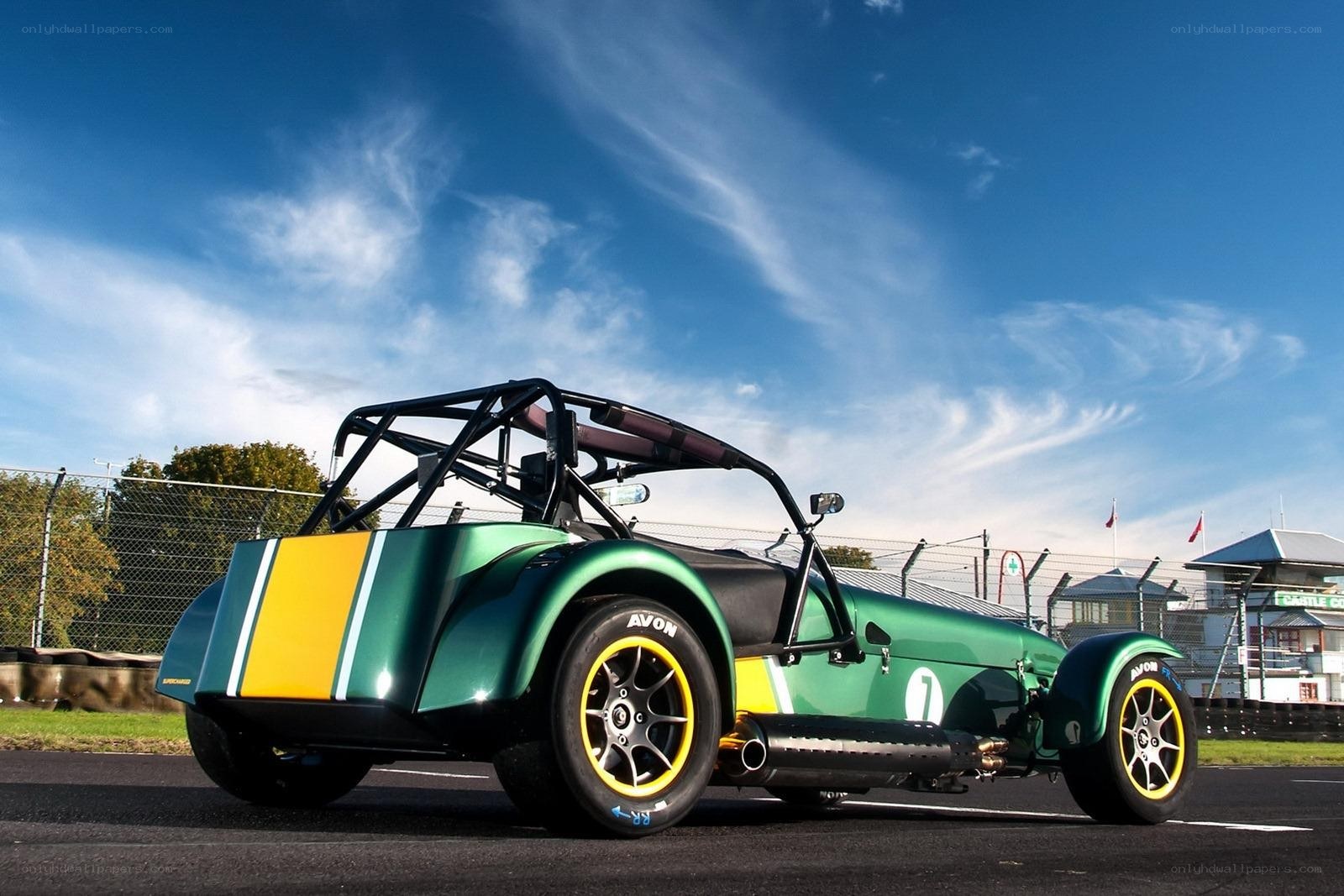 Green race car on track