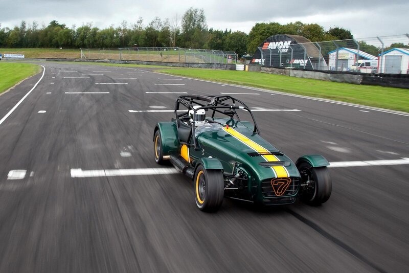 Green race car on track