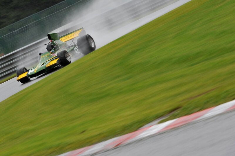Green race car on track