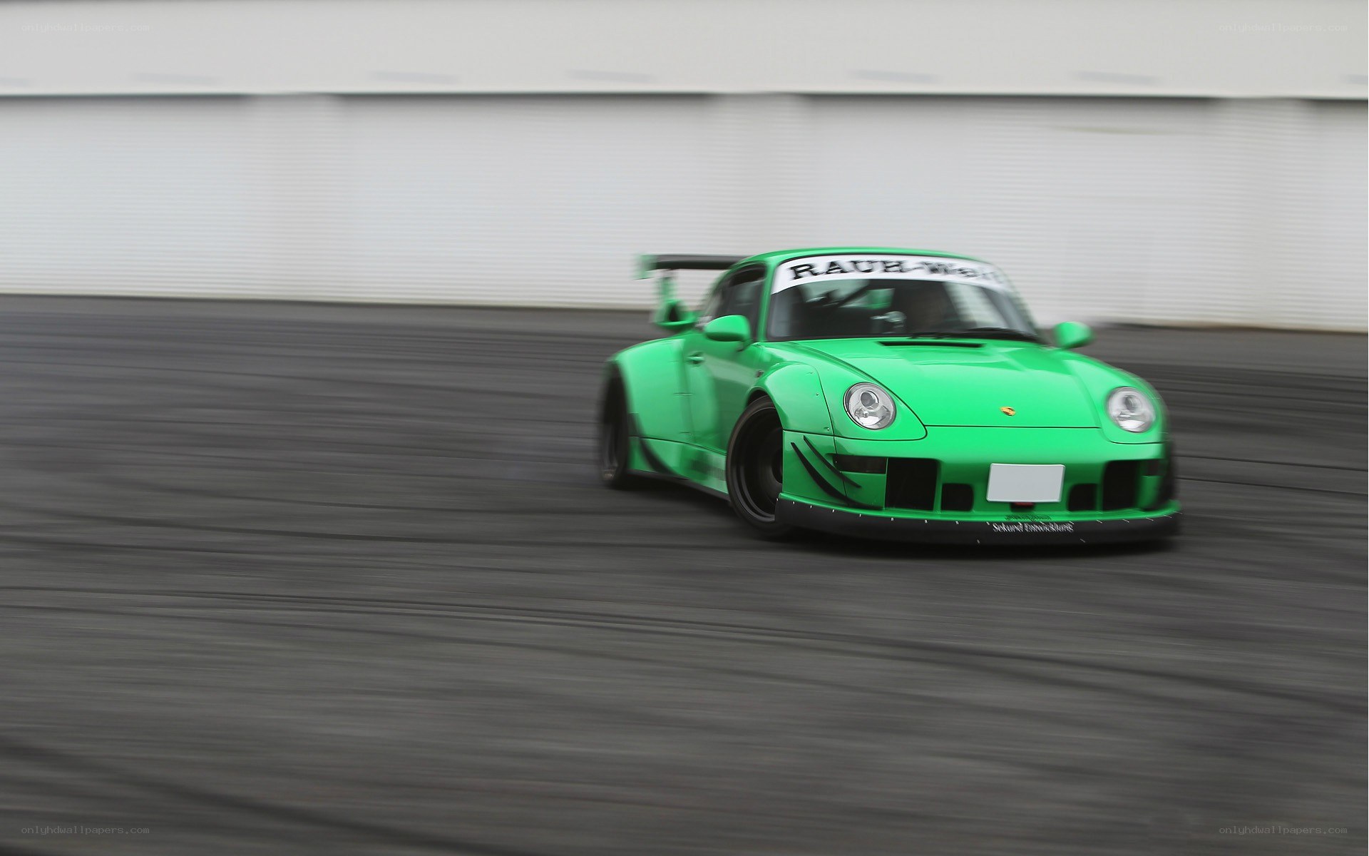 green race car on track