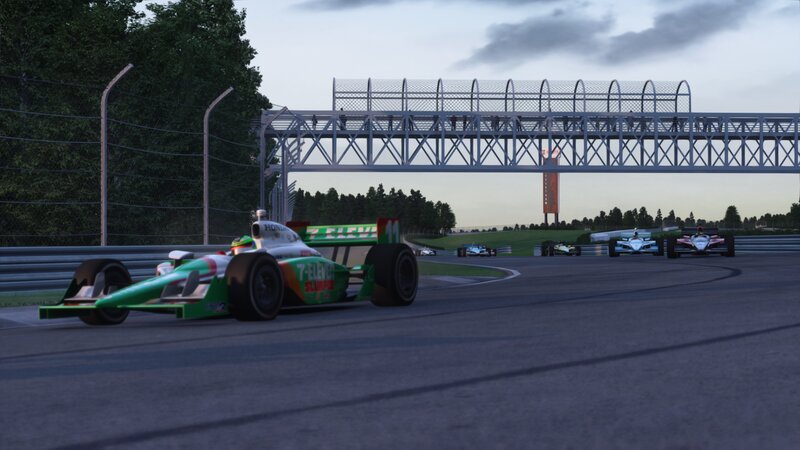 Green Race Car on Track — Competitive, Sunset