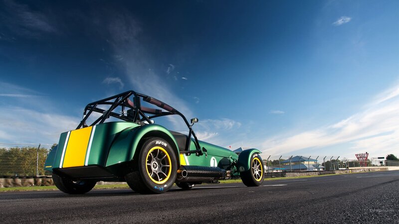 Green Race Car on Track — Dramatic