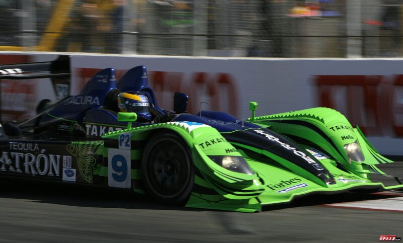 Green Race Car on Track — Dynamic, Afternoon, Photograph, Driver, Race Car