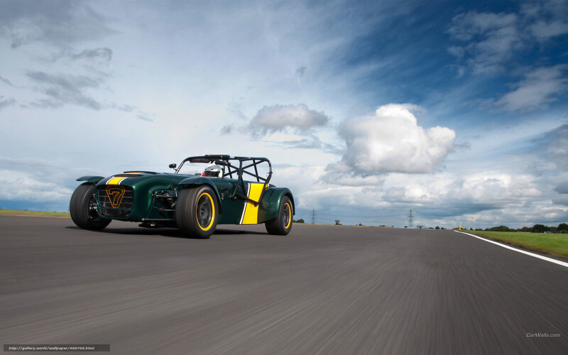 Green Race Car on Track — Dynamic, Afternoon, Photograph, Driver, Race Track, Clouds