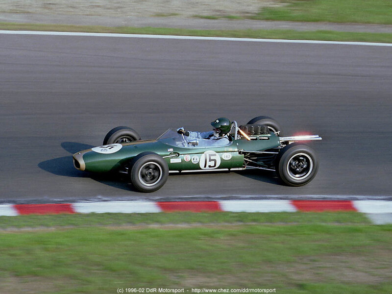 Green Race Car on Track — Dynamic, Afternoon, Photograph, Driver, Race Track, Grass