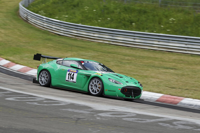 Green Race Car on Track — Dynamic, Afternoon, Photograph, Race Car