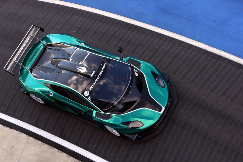 Green Race Car on Track — Dynamic, Afternoon, Photograph, Race Car, Wing