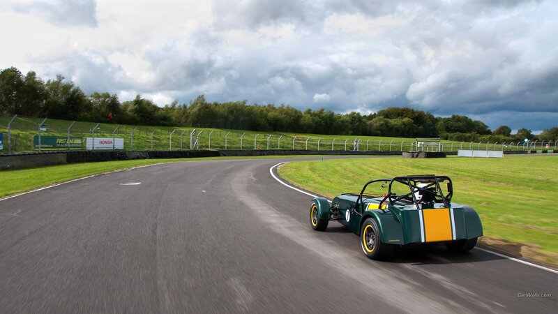 Green Race Car on Track — Dynamic, Afternoon, Photograph, Race Track, Grass
