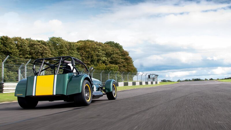 Green Race Car on Track — Dynamic, Afternoon, Photograph, Race Track, Trees