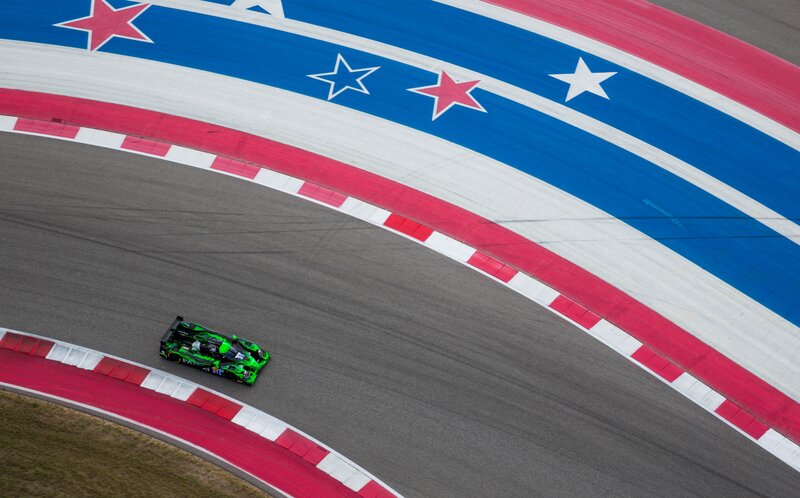Green Race Car on Track — Dynamic, Photograph, Race Car, Racetrack
