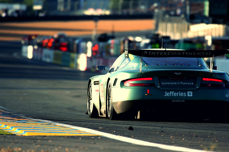 Green Race Car on Track — Dynamic, Sunset, Photograph, Race Track, Tire Marks