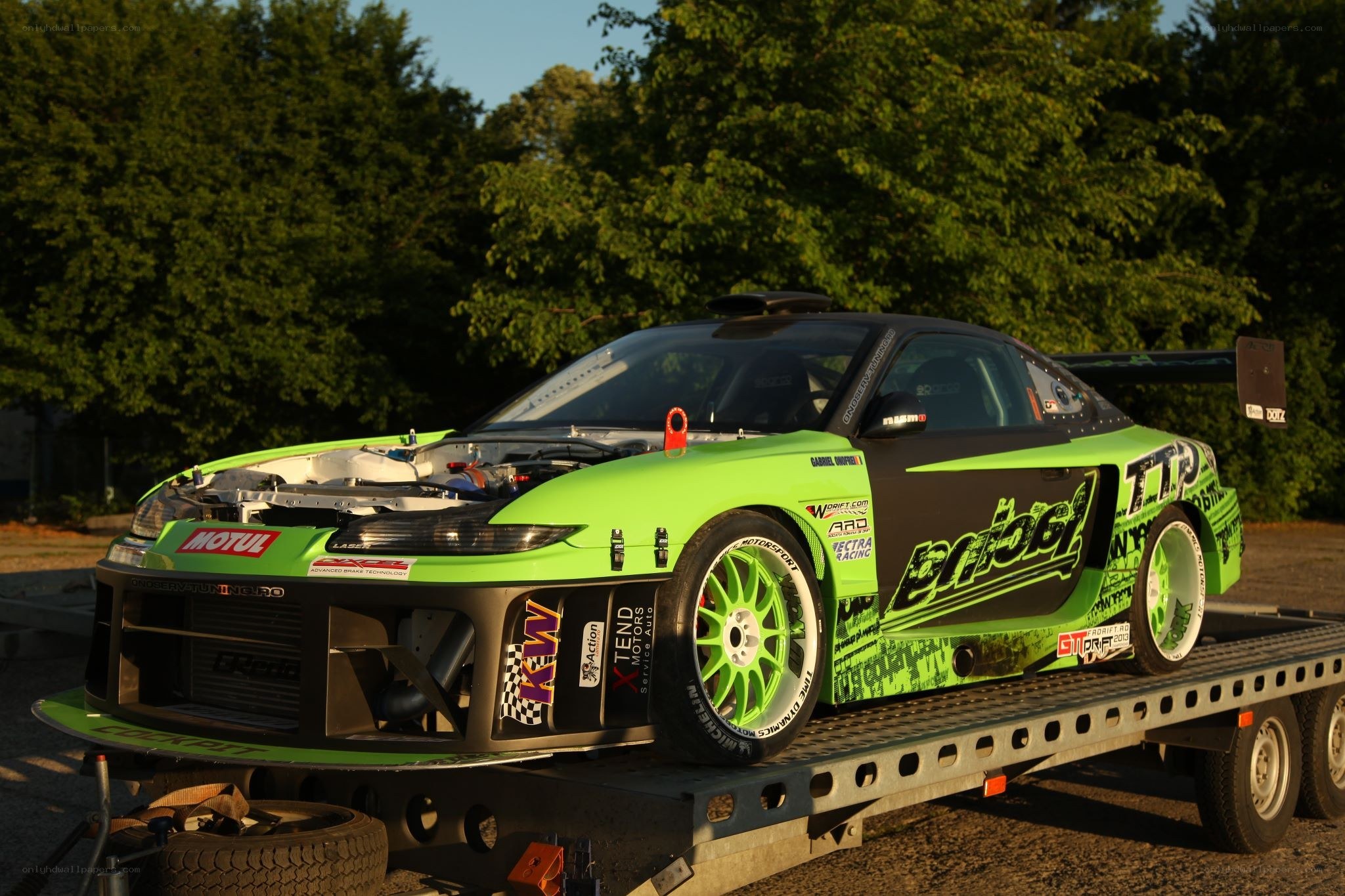 green race car on trailer