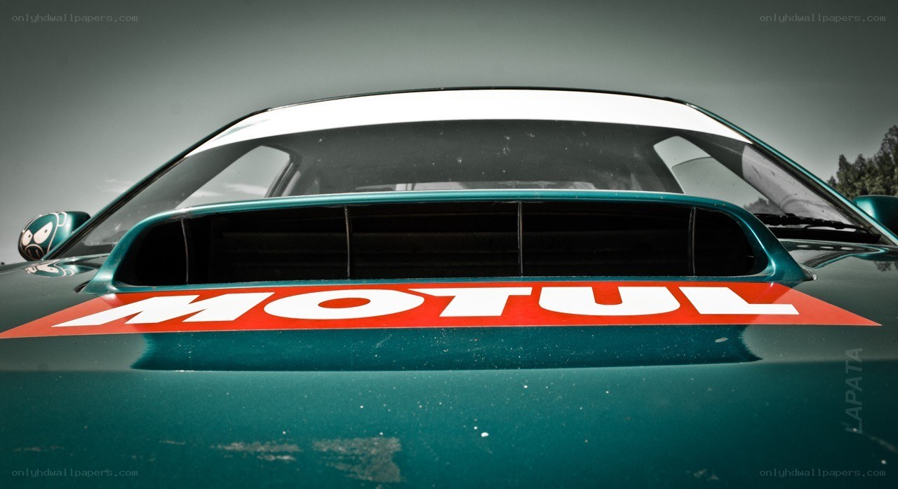 green race car with Motul logo