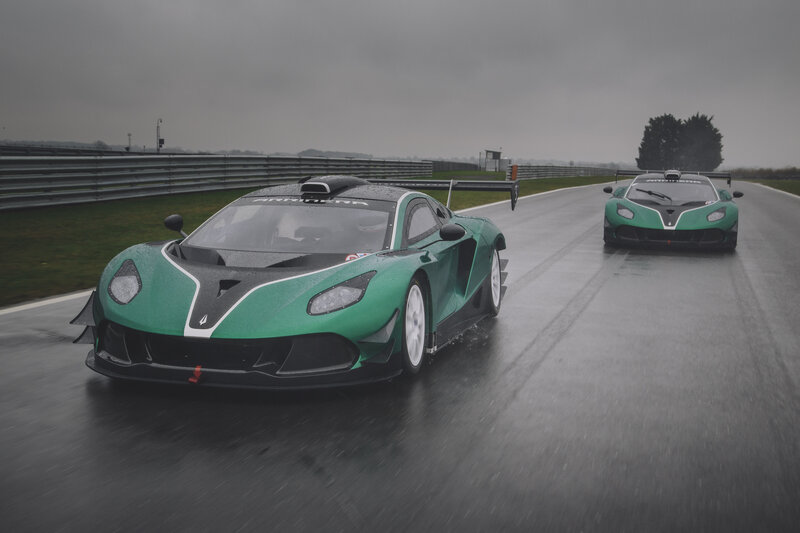 Green Race Cars on Track — Dramatic