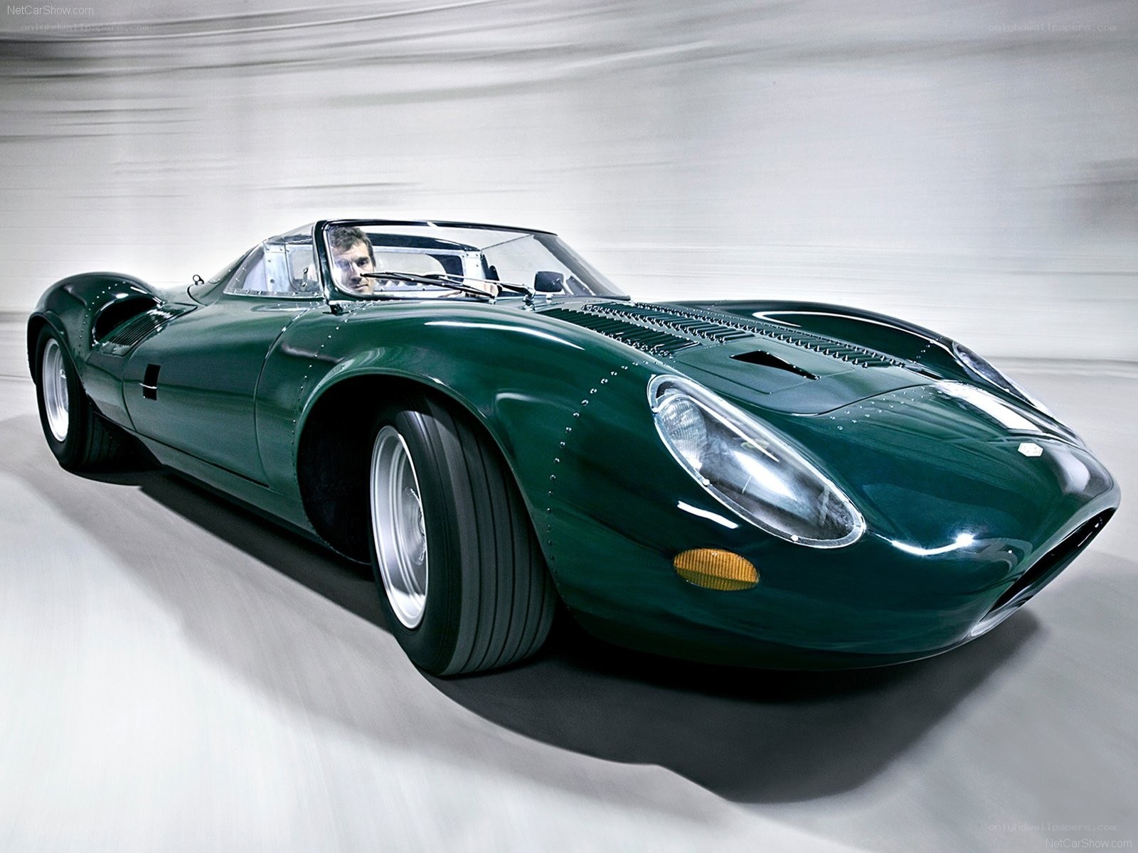 Green racing car in motion